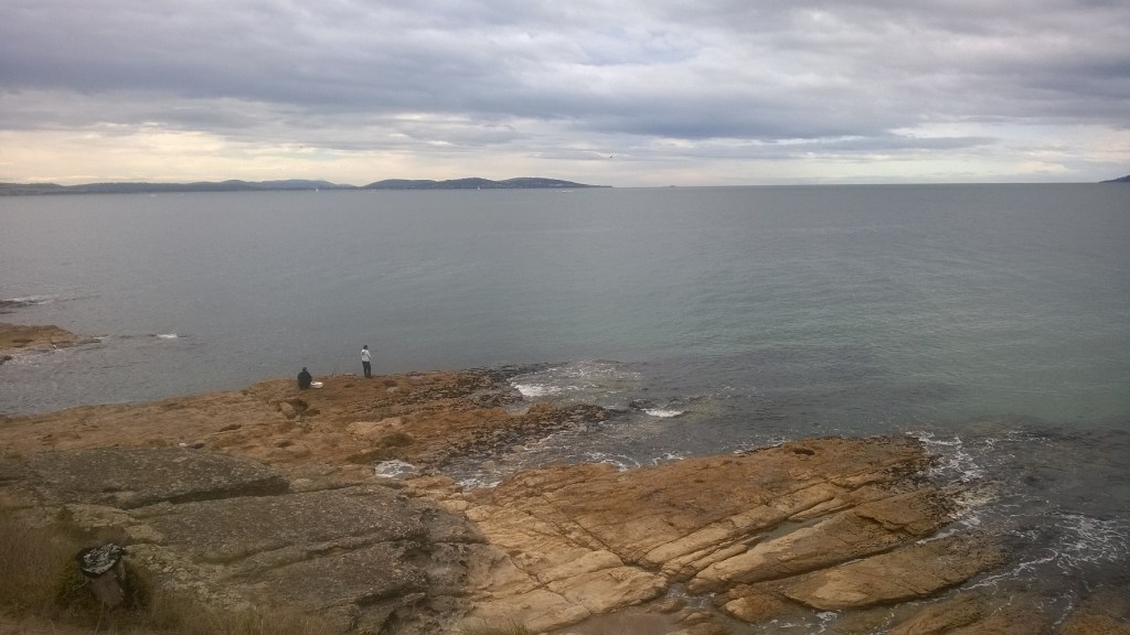 Fishing from the rocks .